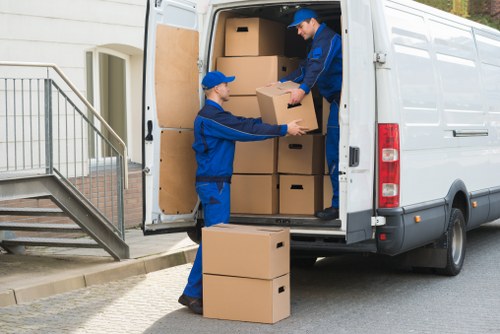 Relocation crew handling delicate belongings during a household move