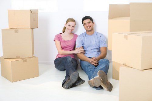 Mover wearing PPE while carrying furniture