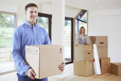 Packed boxes and furniture prepared for a removal van in Barnes