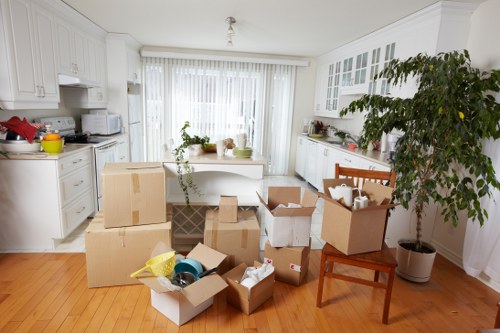 Packed moving boxes and furniture prepared for removals in Barnes