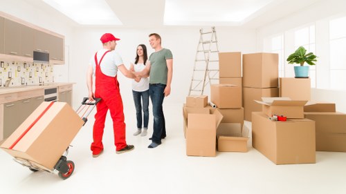 Professional movers loading furniture with organized transport methods