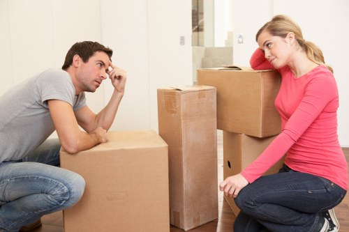 Professional movers packing household items in Barnes