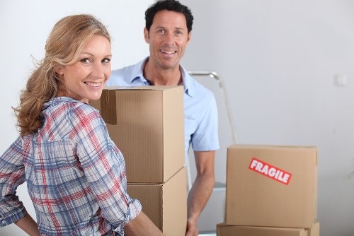 Team organizing a planned office move in Barnes with labeled boxes