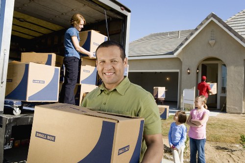 Man with van Barnes handling office furniture and storage items