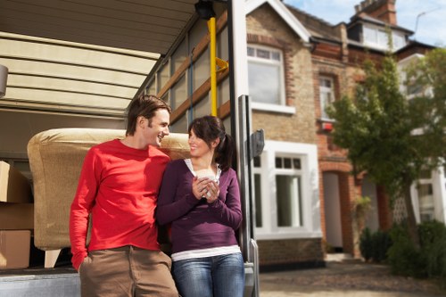 Moving large household furniture during removals in Barnes